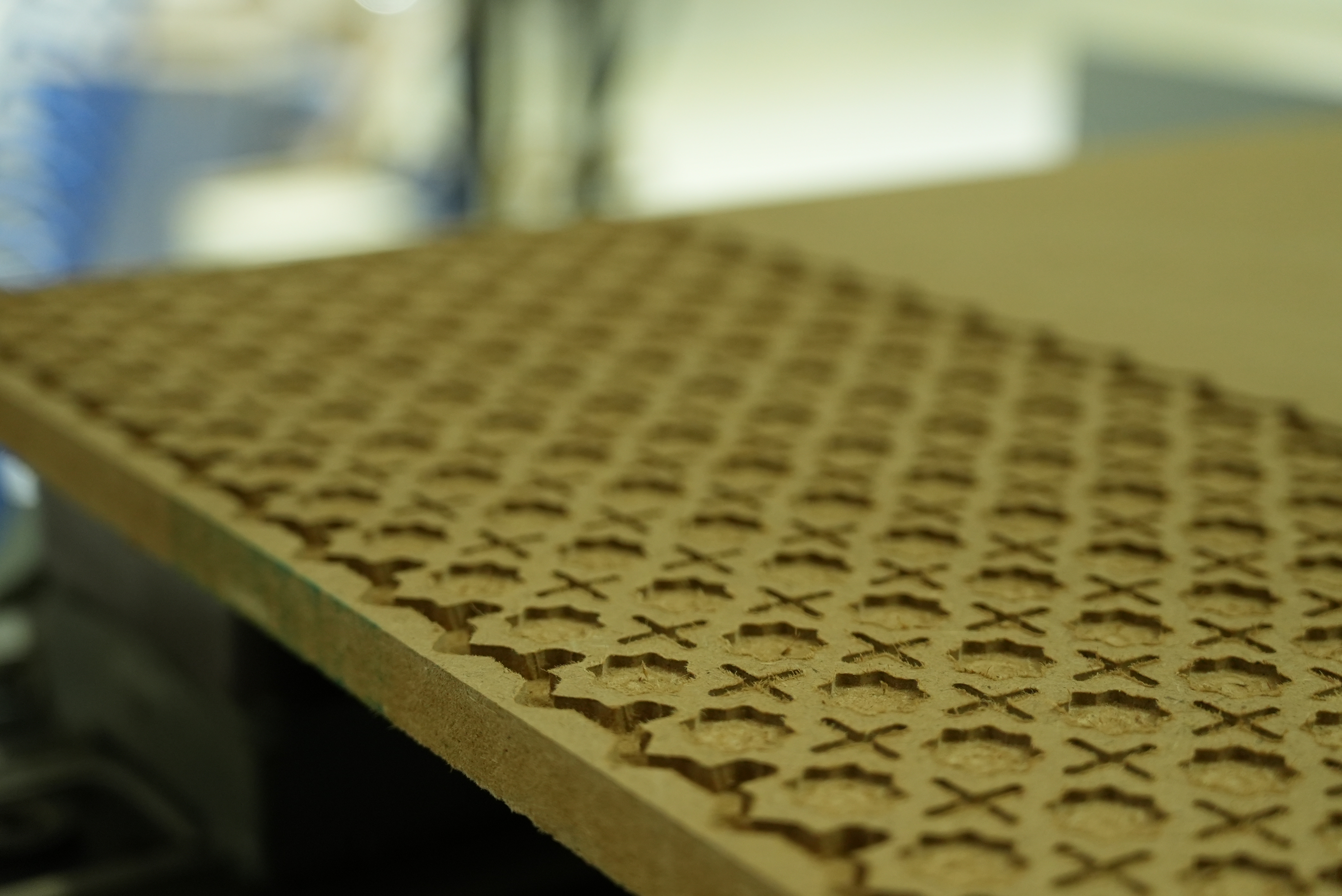 CNC-carved geometric wood panel detail